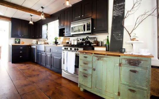 Think modern black cabinetry won’t work with your antiques?