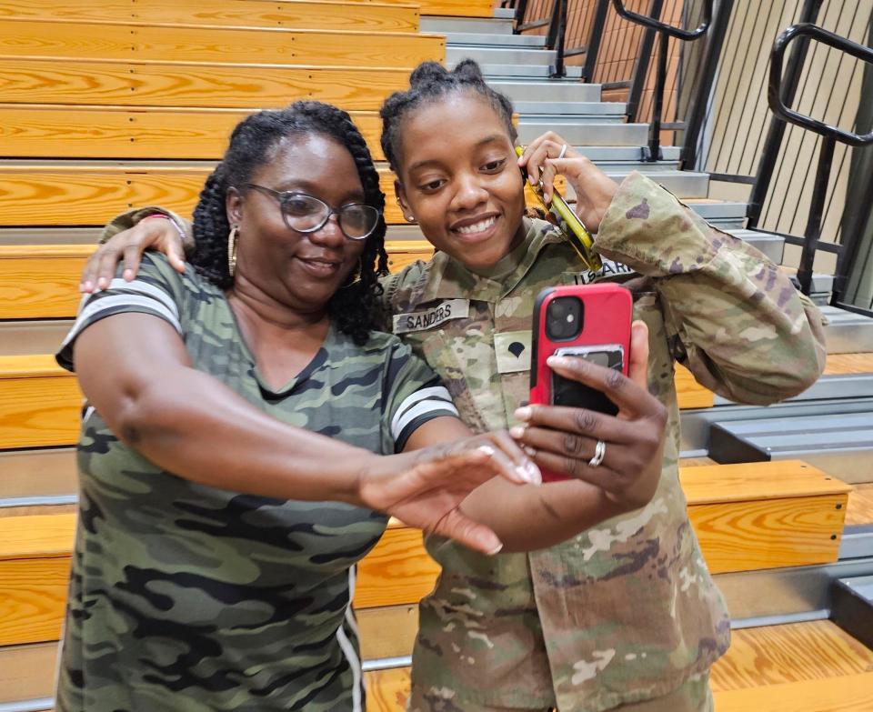 This undated image provided by Shawn Sanders shows Army Spc. Kennedy Sanders, right, posing for a selfie with her mother, Oneida Oliver-Sanders, at a ceremony in Columbus, Ga., on Aug. 9, 2023. The 24-year-old Army reservist's parents confirmed she was among three U.S. service members killed Sunday, Jan. 28, 2024, by a drone strike at their base in Jordan near the border with Syria. Sanders of Waycross, Georgia, joined the Army Reserve five years ago, her parents said, and was taking college courses to become an X-ray technician.