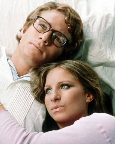 <p>Silver Screen Collection/Getty</p> Ryan O'Neal and Barbra Streisand in What's Up, Doc? in 1972.