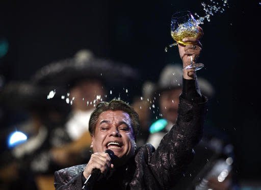 FILE - In this Nov. 5, 2009, file photo, Juan Gabriel performs at the 10th Annual Latin Grammy Awards in Las Vegas. Representatives of Juan Gabriel have reported Sunday, Aug. 28, 2016, that he has died. (AP Photo/Matt Sayles, File)