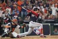 Washington Nationals' Juan Soto hits a two-run scoring double during the fifth inning of Game 1 of the baseball World Series against the Houston Astros Tuesday, Oct. 22, 2019, in Houston. (AP Photo/David J. Phillip)