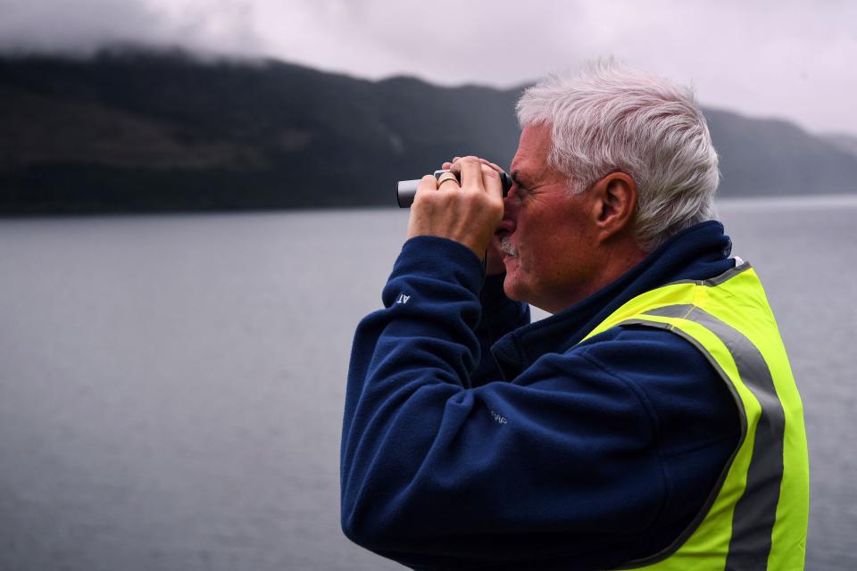 Self-proclaimed Nessie hunter Michael Holian watches over Loch Ness in the hope of spotting the elusive monster Nessie in Scotland on Aug. 27, 2023.
