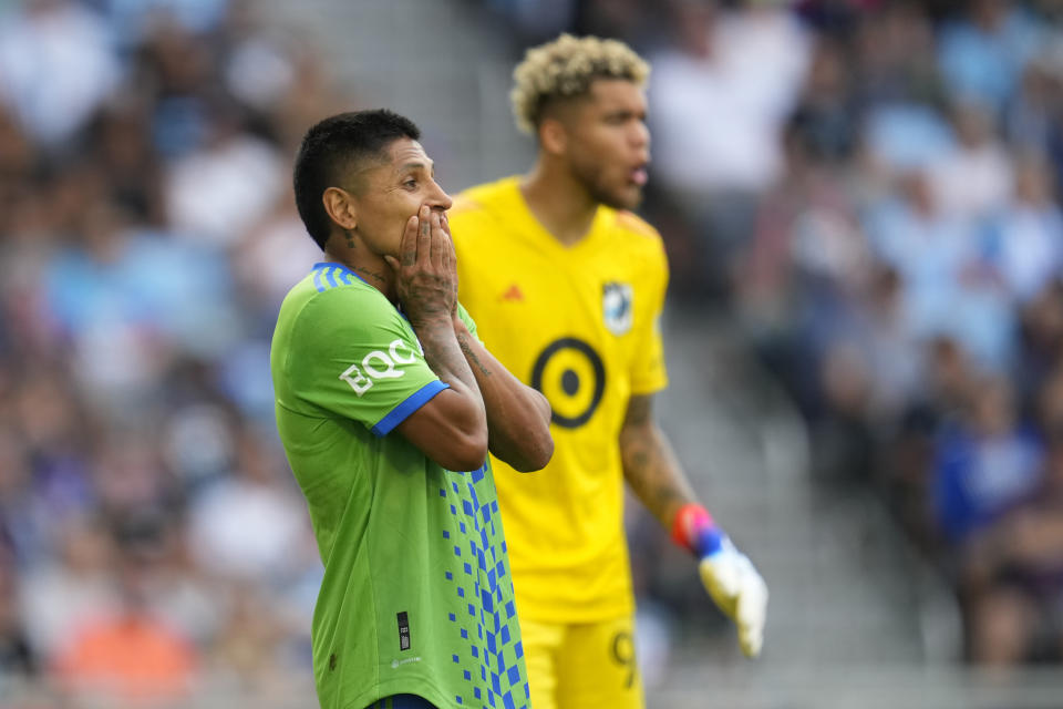 Seattle Sounders forward Raúl Ruidíaz, left, reacts after a missed scoring opportunity during the second half of an MLS soccer match against Minnesota United, Sunday, Aug. 27, 2023, in St. Paul, Minn. (AP Photo/Abbie Parr)