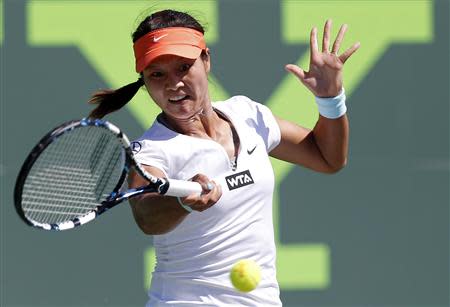 Mar 23, 2014; Miami, FL, USA; Li Na hits a forehand against Madison Keys (not pictured) on day seven of the Sony Open at Crandon Tennis Center. Mandatory Credit: Geoff Burke-USA TODAY Sports