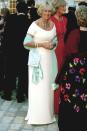 Camilla smiling in a long, white gown at a society party at a fundraising charity at Somerset House.