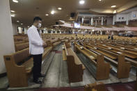 A pastor wearing a face mask to help protect against the spread of the coronavirus prays during a service at the Yoido Full Gospel Church in Seoul, South Korea, Sunday, Sept. 20, 2020. South Korea's new coronavirus tally has fallen below 100 for the first time in more than a month. (AP Photo/Ahn Young-joon)