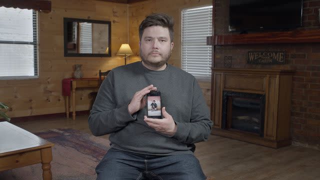 <p>courtesy netflix</p> Jose Trujillo holding a photo of his son Dan.