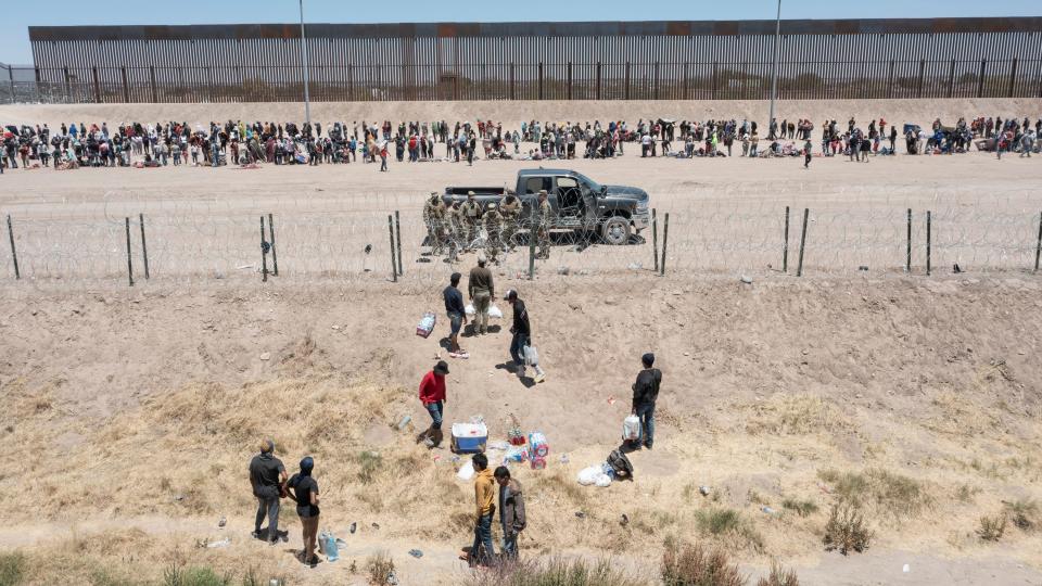 Migrants are stopped by Texas National Guard from entering gate 42 with the intention to surrender to Customs and Border Protection on the last day of Title 42 on Thursday, May 11, 2023 in El Paso, Texas. 