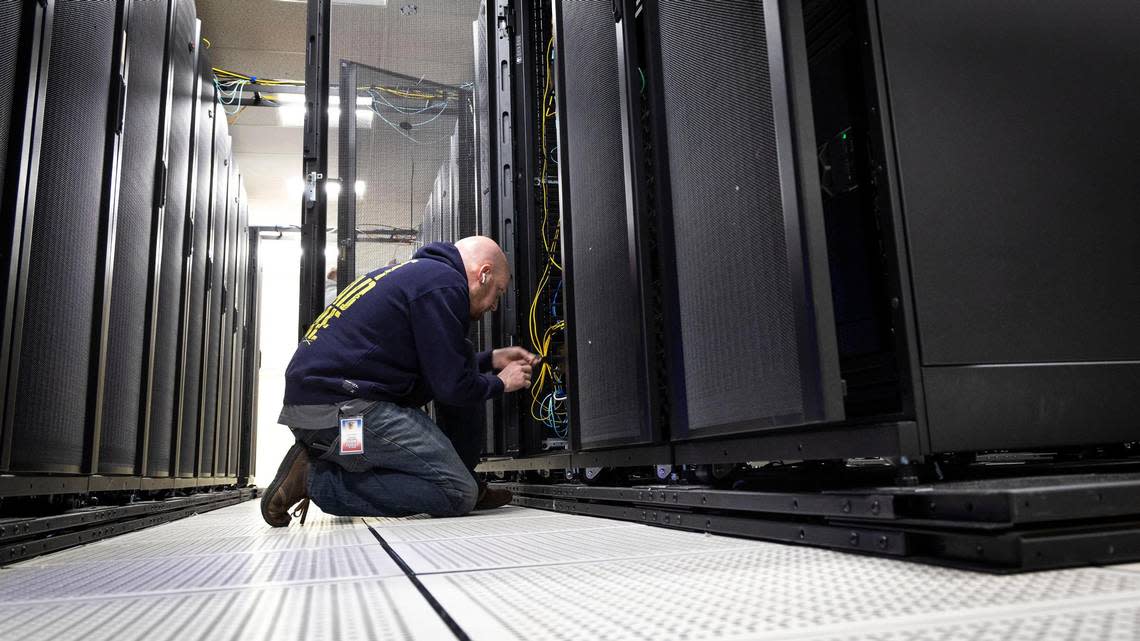 Anthony Banta, lead network engineer with ITS, installs new hardware at a secure server facility operated by the Idaho State Controller’s Office. Darin Oswald/doswald@idahostatesman.com