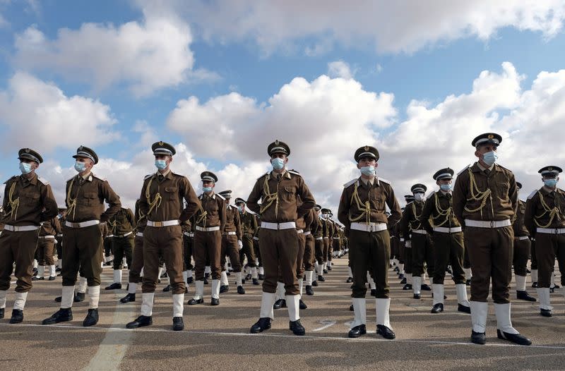 FILE PHOTO: Soldiers loyal to Libyan military commander Khalifa Haftar stand in formation during Independence Day celebrations in Benghazi