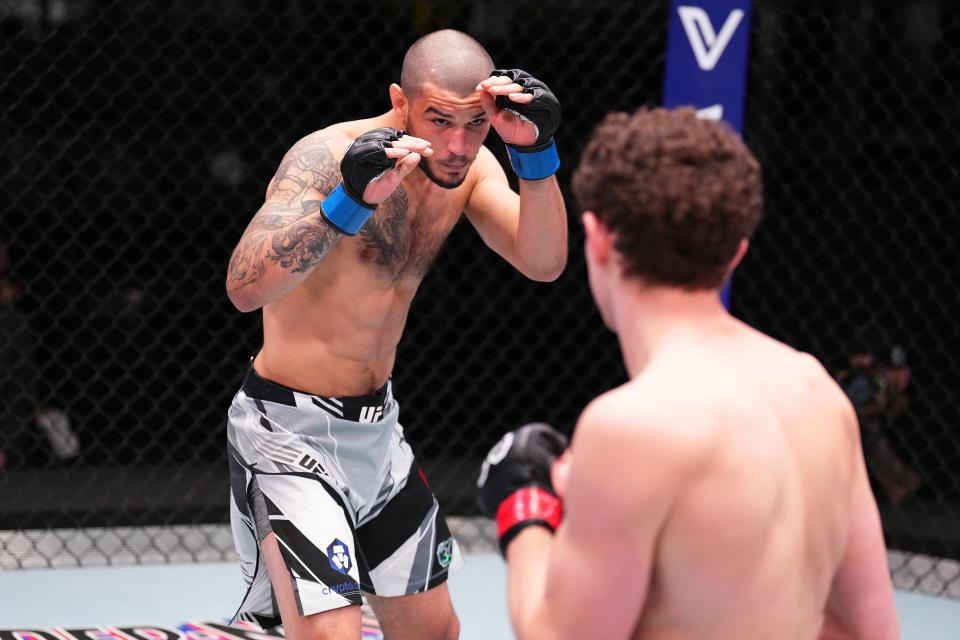 LAS VEGAS, NEVADA - MAY 20: (L-R) Nick Fiore takes on Chase Hooper in a lightweight bout during the UFC Fight Night event at UFC APEX on May 20, 2023 in Las Vegas, Nevada.  (Photo by Chris Unger/Zuffa LLC via Getty Images)