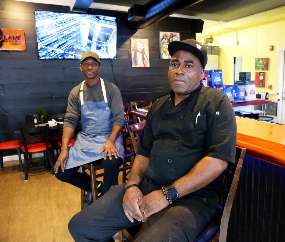 Ramon Hinds, left, and Christopher Nicely take a break from the kitchen at Flame in Somersworth Wednesday, Feb. 28, 2024.