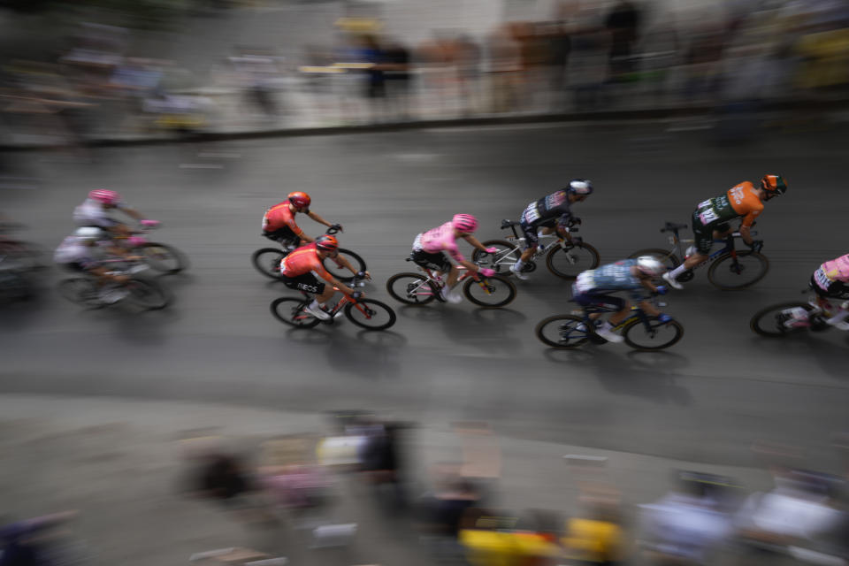 The pack rides during the third stage of the Tour de France cycling race over 230.8 kilometers (143.4 miles) with start in Piacenza and finish in Turin, Italy, Monday, July 1, 2024. (AP Photo/Jerome Delay)