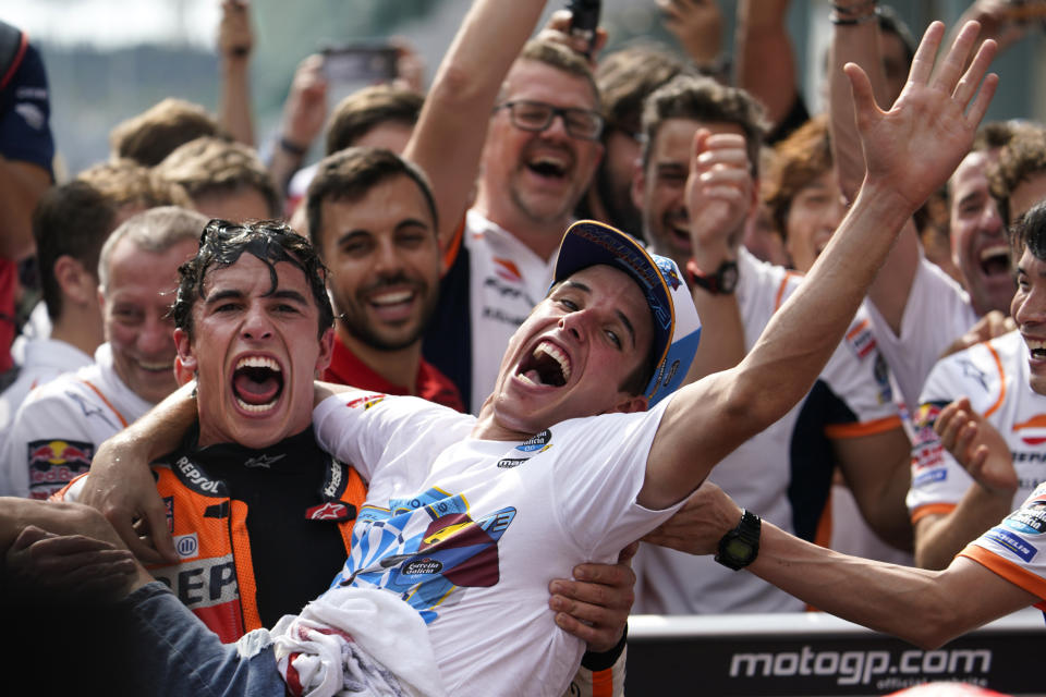 In this Sunday, Nov. 3, 2019, file photo, Spain's MotoGP rider Marc Marquez, left, celebrates with his brother Spain's Moto2 rider Alex Marquez after winning the second place of MotoGP race of the Malaysia Motorcycle Grand Prix at Sepang International circuit in Sepang. (AP Photo/Vincent Thian, File)