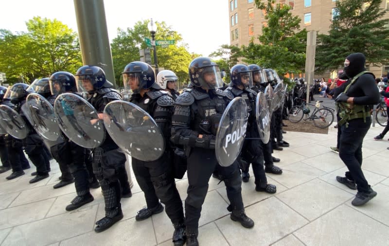 U.S. Secret Service face off with protestors near White House in Washington