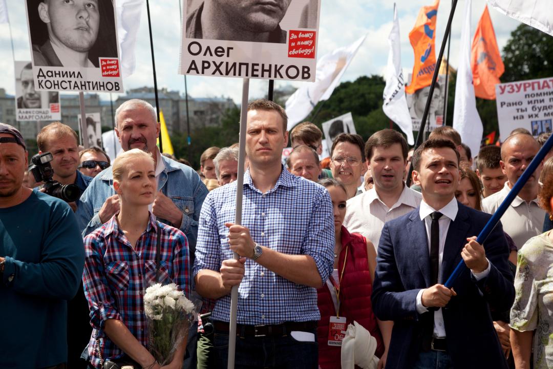 Moscow, Russia. 12 of June, 2013 Opposition leader Alexey Navalny (C), his wife Yulia Navalny (L) and opposition leader Ilya Yashin (R) participate in the 
