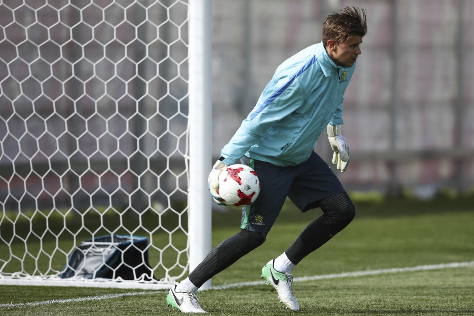 FILE - Australia's goalkeeper Mitch Langerak attends a training session at the Spartak Stadium in Moscow, Russia on June 23, 2017. Australia coach Graham Arnold has drafted in eight fresh players and welcomed Mitch Langerak’s decision to come out of retirement and join fellow goalkeepers Mat Ryan and Andrew Redmayne in a 31-player squad for the Socceroos’ World Cup warmup games against New Zealand. (AP Photo/Denis Tyrin, File)