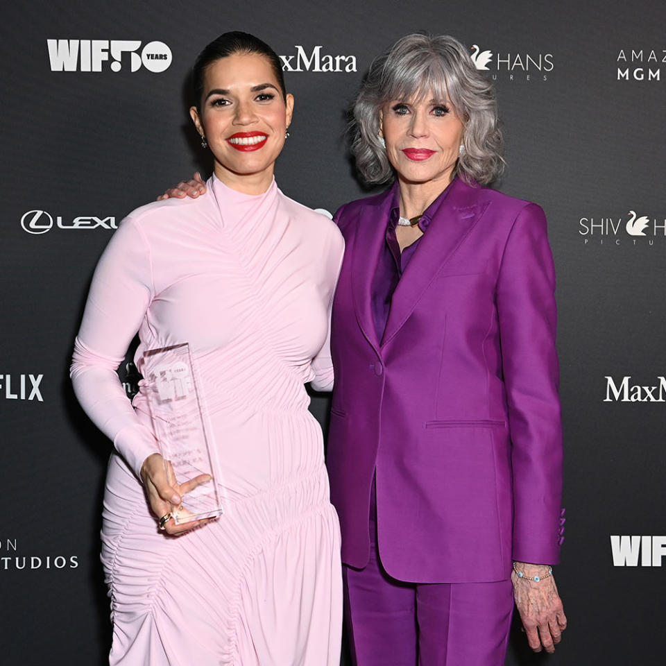 Winner of the Jane Fonda Humanitarian Award America Ferrera, wearing Sportmax and Jane Fonda, wearing Max Mara, pose backstage during WIF Honors Presented by Max Mara on November 30, 2023 in Los Angeles, California.