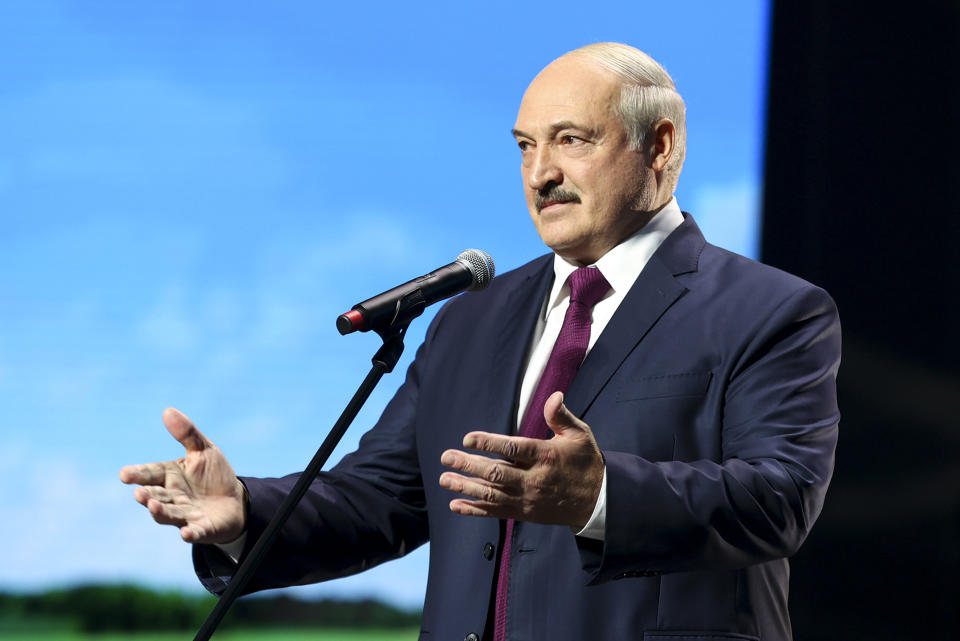 Belarusian President Alexander Lukashenko gestures while addressing a women's forum in Minsk, Belarus, Thursday, Sept. 17, 2020. Lukashenko has given a speech at a women's forum with some good quotes—he's announced Belarus will close the border with Ukraine, Poland and Lithuania, and is mobilizing half the army. (BelTA Pool Photo via AP)