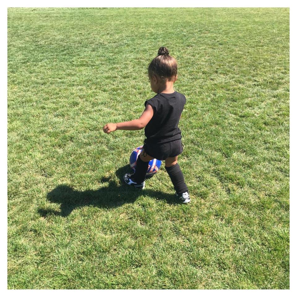 Break out the luxury minivans, Kim Kardashian is officially a soccer mom! The reality star posted adorable pics of 2-year-old daughter North West playing soccer on Friday, and it sounds like Kim is ready to embrace the role proudly. <strong>WATCH: North West Adorably Indulges in Sweet Treat, But Majorly Misses Her Mouth </strong> "Officially a soccer mom!" Kim wrote on one pic, adding the hashtag "#MyLittleGoalie" along with the soccer ball emoji. <strong>WATCH: North West Is the Most Chic Ballerina Ever </strong> North dressed for the part, ever-so-stylishly in all black, but also kept safe with shin guards, knee-high socks and appropriate footwear. "She's doing so good," Kim gushed on the last photo in the set. "I'm just so proud!" <strong>WATCH: Kim Kardashian Reveals Hopes For Herself and Daughter North West in 10 Years</strong>