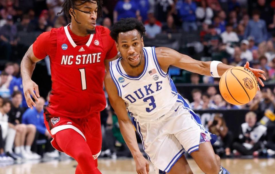 Duke’s Jeremy Roach (3) drives past N.C. State’s Jayden Taylor (1) during the first half of N.C. State’s game against Duke in their NCAA Tournament Elite Eight matchup at the American Airlines Center in Dallas, Texas, Sunday, March 31, 2024.