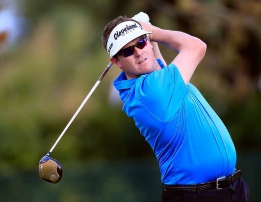 Charlie Beljan plays a shot on the 18th hole during the third round of the Children's Miracle Network Hospitals Classic at the Disney Magnolia course in Lake Buena Vista, Florida. Beljan shook off an uncomfortable night in hospital, firing a one-under par 71 to stay atop the leaderboard