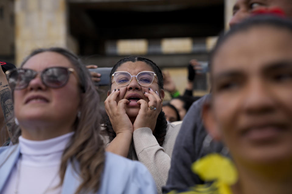 Supporters of President Gustavo Petro attend his swearing-in ceremony at the Bolivar square in Bogota, Colombia, Sunday, Aug. 7, 2022. (AP Photo/Ariana Cubillos)