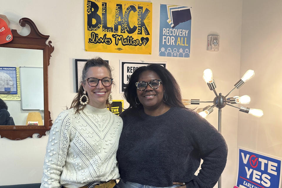 Callie Gale Heilmann, left, founder, President, and Co-Director of Bridgeport Generation Now, a local social action network, and Gemeem Davis, the vice president of the organization, pose for a photo in Bridgeport, Conn., Wednesday, Feb. 21, 2024. They're hoping people will still come out to vote, despite this being the fourth election —two primaries and two general elections — and defeat incumbent Mayor Joe Ganim. (AP Photo/Susan Haigh)