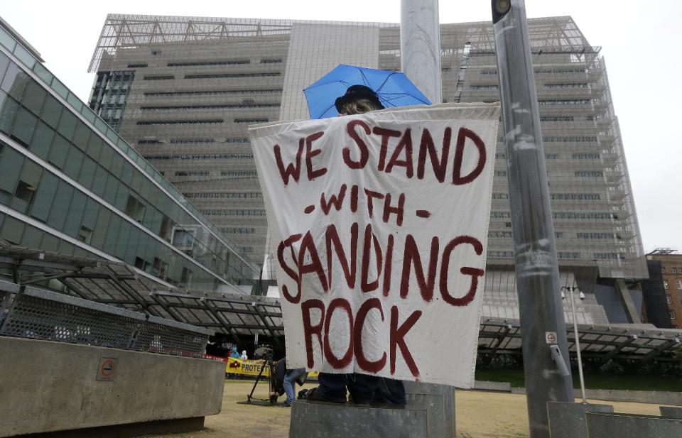 Opponents of the Dakota Access oil pipeline protest at the San Francisco Federal Building in San Francisco, Wednesday, Feb. 8, 2017. Opponents of the Dakota Access oil pipeline called for protests around the world Wednesday as the Army prepared to green-light the final stage of the $3.8 billion project's construction. (AP Photo/Jeff Chiu)