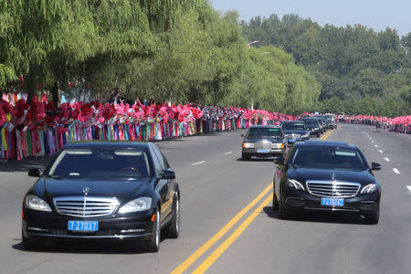 A convoy of vehicles transporting South Korean President Moon Jae-in and North Korean leader Kim Jong Un is seen during a car parade in Pyongyang, North Korea, September 18, 2018. Pyeongyang Press Corps/Pool via REUTERS