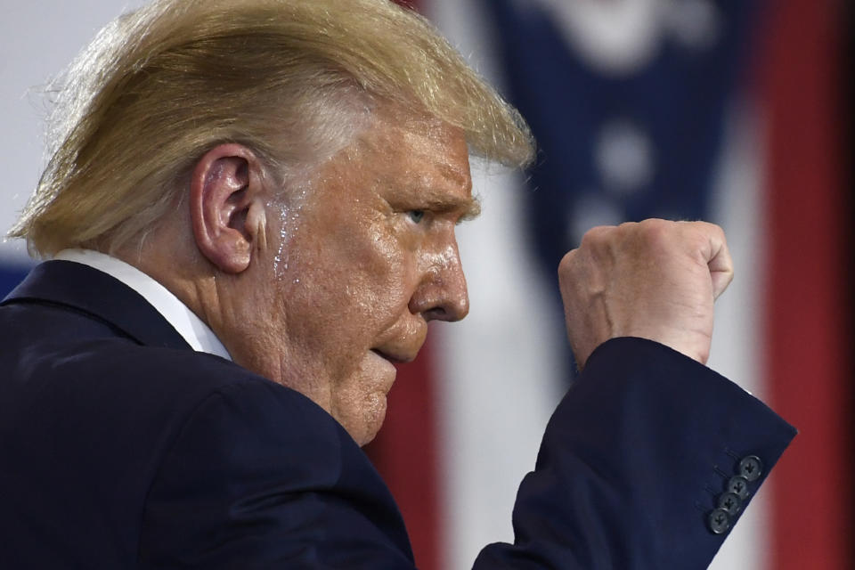 President Donald Trump pumps his fist as he finishes speaking during an event at the Whirlpool Corporation facility in Clyde, Ohio, Thursday, Aug. 6, 2020. (AP Photo/Susan Walsh)