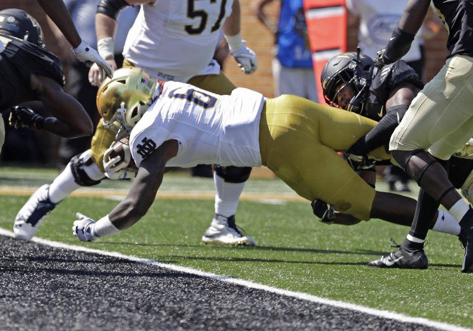 Notre Dame’s Tony Jones Jr. (6) dives over the gaol line for a touchdown against Wake Forest in the first half of an NCAA college football game in Winston-Salem, N.C., Saturday, Sept. 22, 2018. (AP Photo/Chuck Burton)