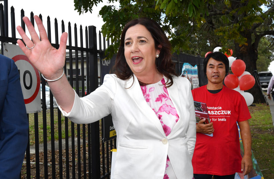 Annastacia Palaszczuk pointing in the direction of the volunteer who heckled her.