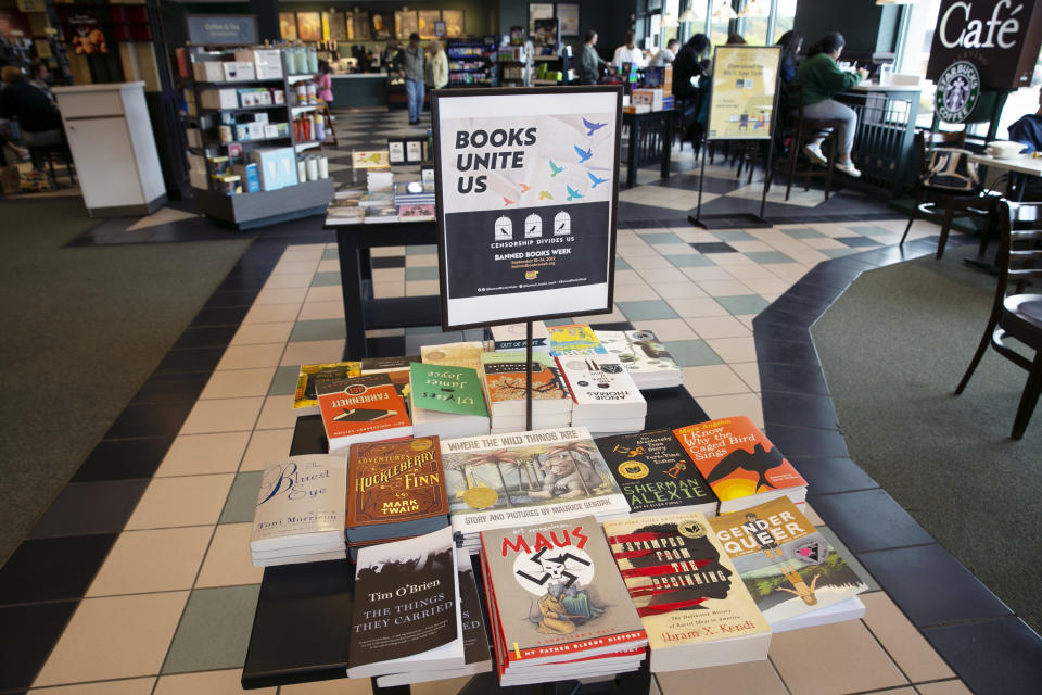 FILE - A display of banned books sits in a Barnes & Noble book store in Pittsford, N.Y., on Sept. 25, 2022. With legislators in Florida barring even the mention of being gay in classrooms and similar restrictions being considered in other states, books with LGBTQ+ themes remain the most likely targets of bans or attempted bans at public schools and libraries around the country, according to a new report Monday, April 24, 2023. (AP Photo/Ted Shaffrey, File)