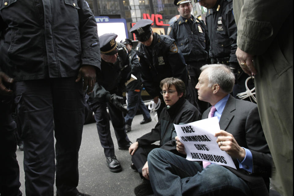 FILE - Matt Forman, right, Executive Director of the National Gay and Lesbian Task Force and Rabbi Sharon Kleinbaum, center, block traffic in New York's Times Square, in an act of civil disobedience, March 15, 2007. After 32 years as a progressive voice for LGBTQ Jews, and leader of Congregation Beit Simchat Torah in midtown Manhattan, Kleinbaum steps into retirement. (AP Photo/Seth Wenig, File)