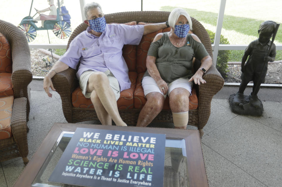 Ira and Ellen Friedman talk about the recent events in The Villages, Fla., retirement community at their home Monday, June 29, 2020. Residents of The Villages say they've never seen anything like the politically inspired hostilities that have surfaced over the past several months. (AP Photo/John Raoux)