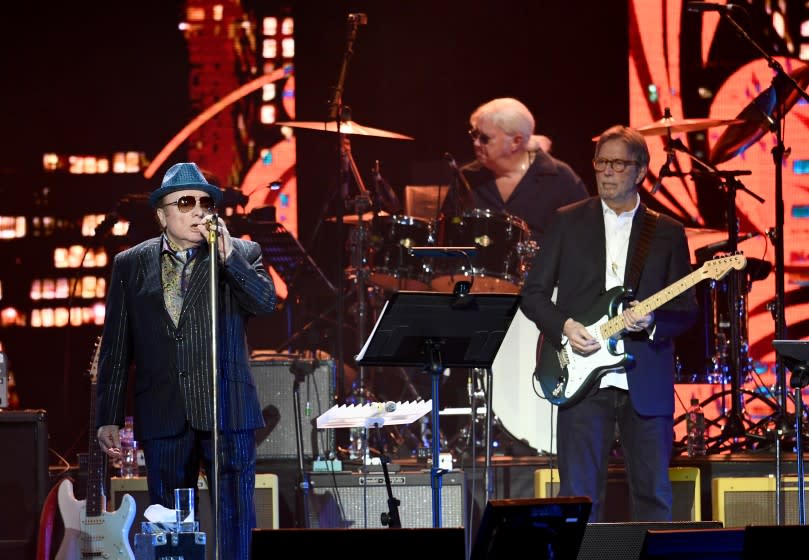 Van Morrison (L) and Eric Clapton perform on stage at London's O2 Arena on March 03, 2020