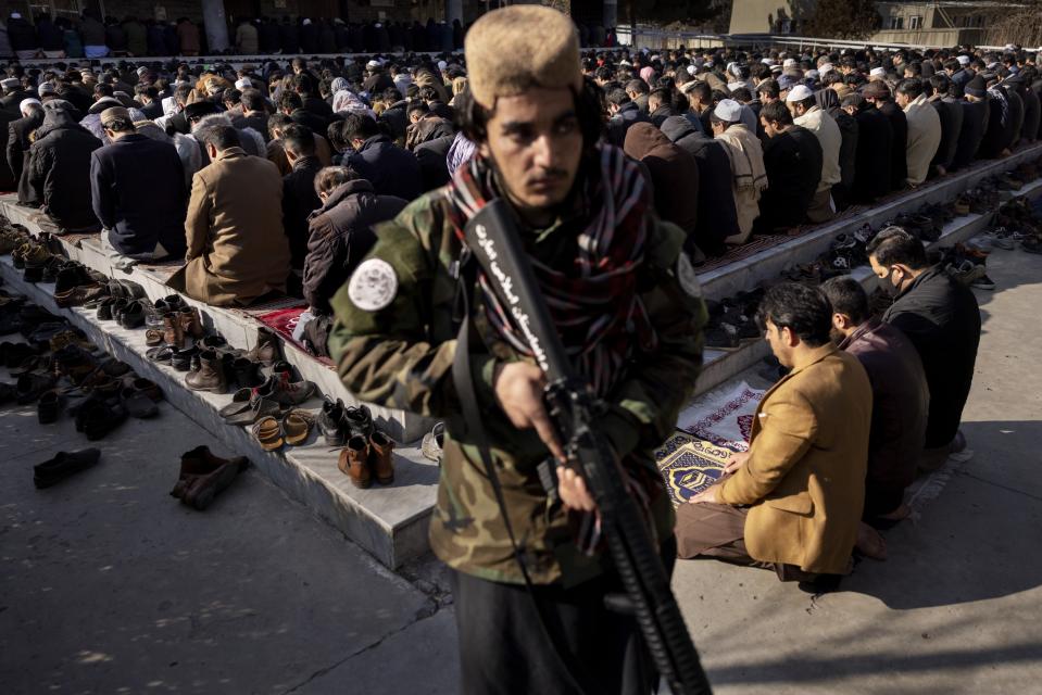 This image provided by World Press Photo is part of a series titled The Price of Peace in Afghanistan which won the World Press Photo Stories award by photographer Mads Nissen, Politiken / Panos Pictures, shows a heavily armed Taliban checkpoint outside Bamiyan. For years, the Taliban waged guerrilla warfare against foreign troops and the Afghan army; now they must guard against attacks by the Islamic State, Jan. 12, 2022. (Mads Nissen, Politiken/Panos Pictures/World Press Photo via AP)