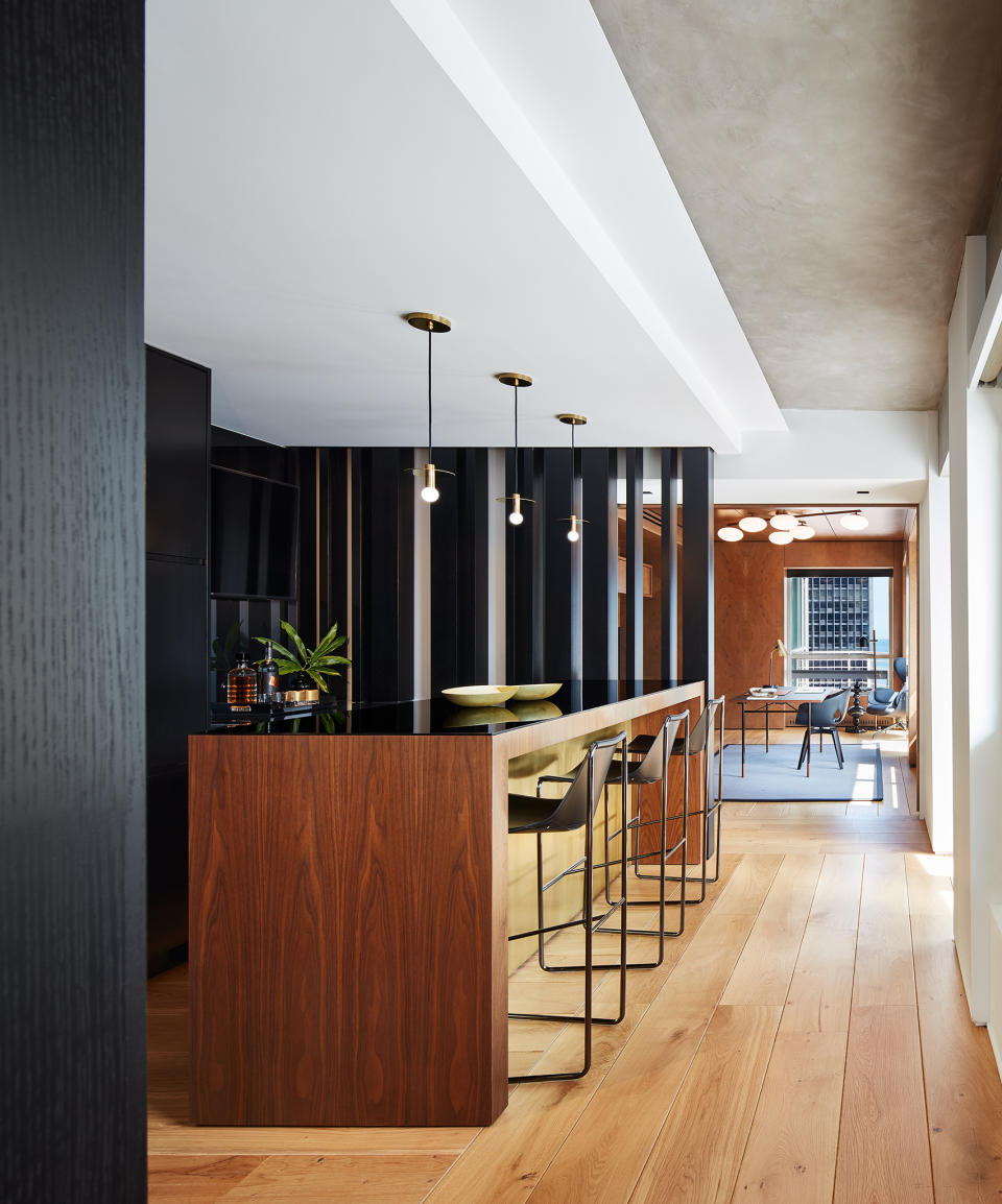 A kitchen island styled with home bar