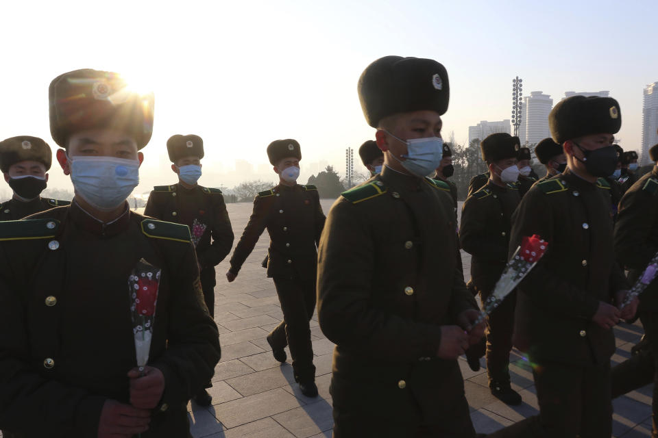 Public Security Forces soldiers visit Mansu Hill to pay respect to the statues of their late leaders Kim Il Sung and Kim Jong Il on the occasion of the 75th founding anniversary of the Korean People's Army in Pyongyang, North Korea Wednesday, Feb. 8, 2023. (AP Photo/Cha Song Ho)