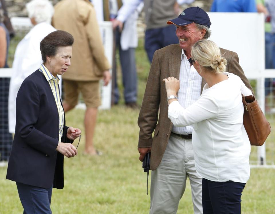 Zara Phillips looks on as her mother Princess Anne, The Princess Royal and father Mark Phillips share a joke during day 1 of the Festival of British Eventing at Gatcombe Park on August 1, 2014 in Minchinhampton, England.