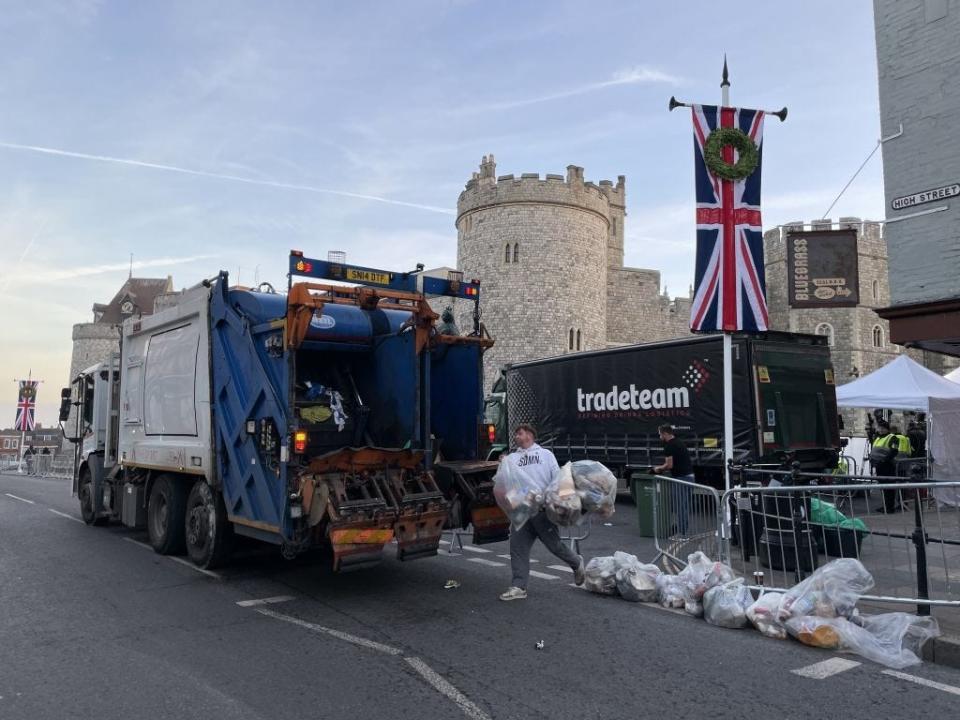 Garbage collectors outside Windsor Castle after Queen Elizabeth's funeral