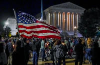 FILE - This photo from Saturday Sept. 19, 2020, shows people gathering at the Supreme Court in Washington to honor the late Justice Ruth Bader Ginsburg, one of the high court's liberal justices, and a champion of gender equality. The chaos unleashed in 2020, amid the coronavirus pandemic, has created space for different voices to speak, for different conversations to be had and for different questions to be asked. (AP Photo/J. Scott Applewhite, File)