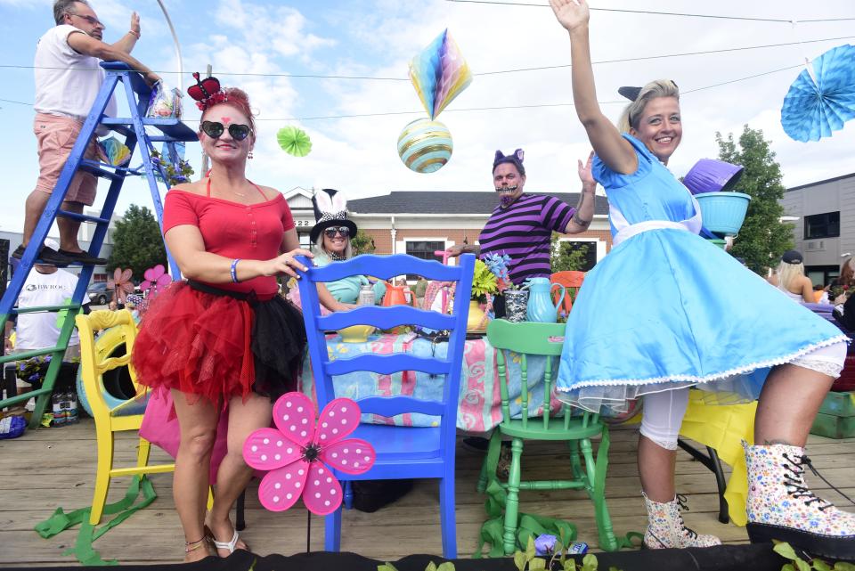 Members of the Blue Water Recovery and Outreach Center dress as characters from the popular children's book "Alive in Wonderland" during the annual Rotary International Day Parade to kick off Port Huron's Boat Week on Wednesday, July 13, 2022.