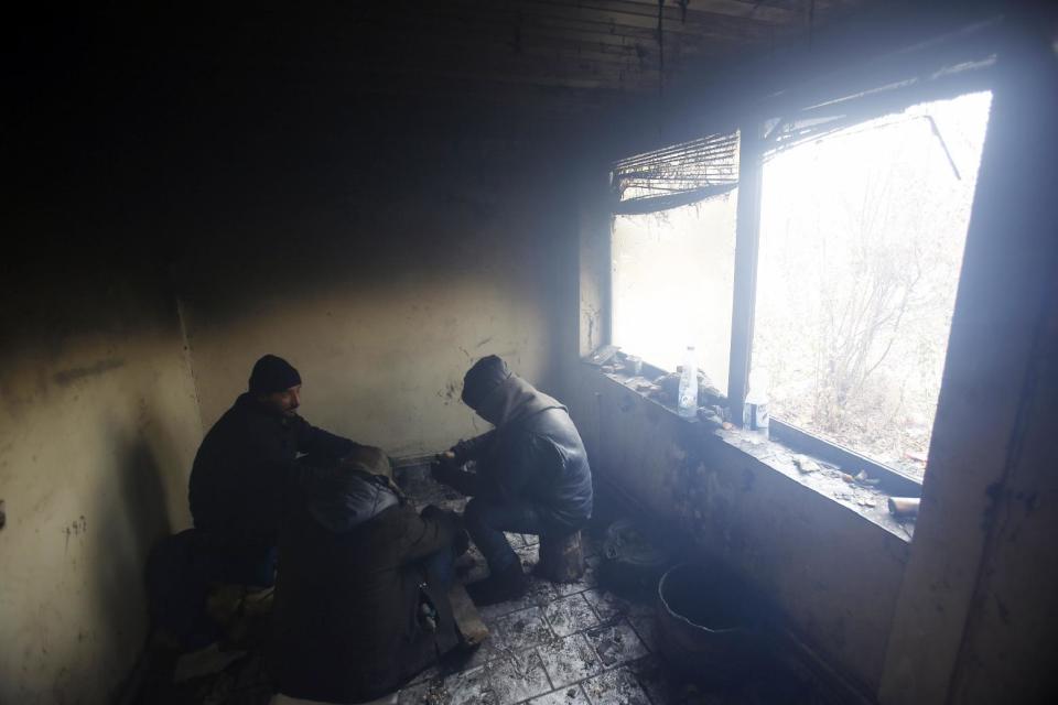 Migrants rest in an abandoned brick factory in the northern Serbian town of Subotica, near the border between Serbia and Hungary, Wednesday, Feb. 1, 2017. Thousands of migrants have been stranded in Serbia and looking for ways to cross illegally into the European Union. (AP Photo/Darko Vojinovic)