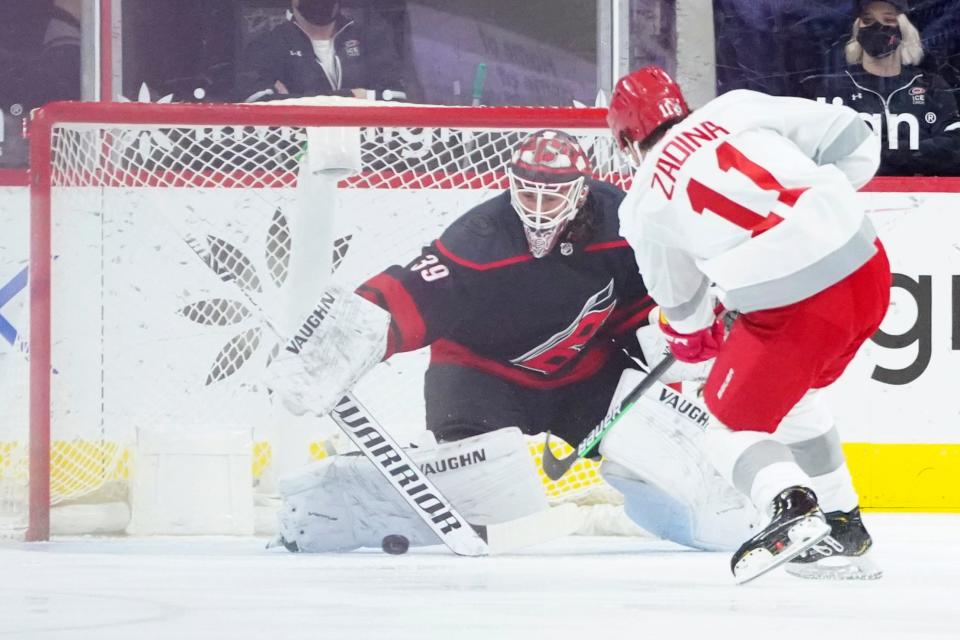 Hurricanes goaltender Alex Nedeljkovic stops a shot by Red Wings right wing Filip Zadina during the first period on Thursday, March 4, 2021, in Raleigh, North Carolina.