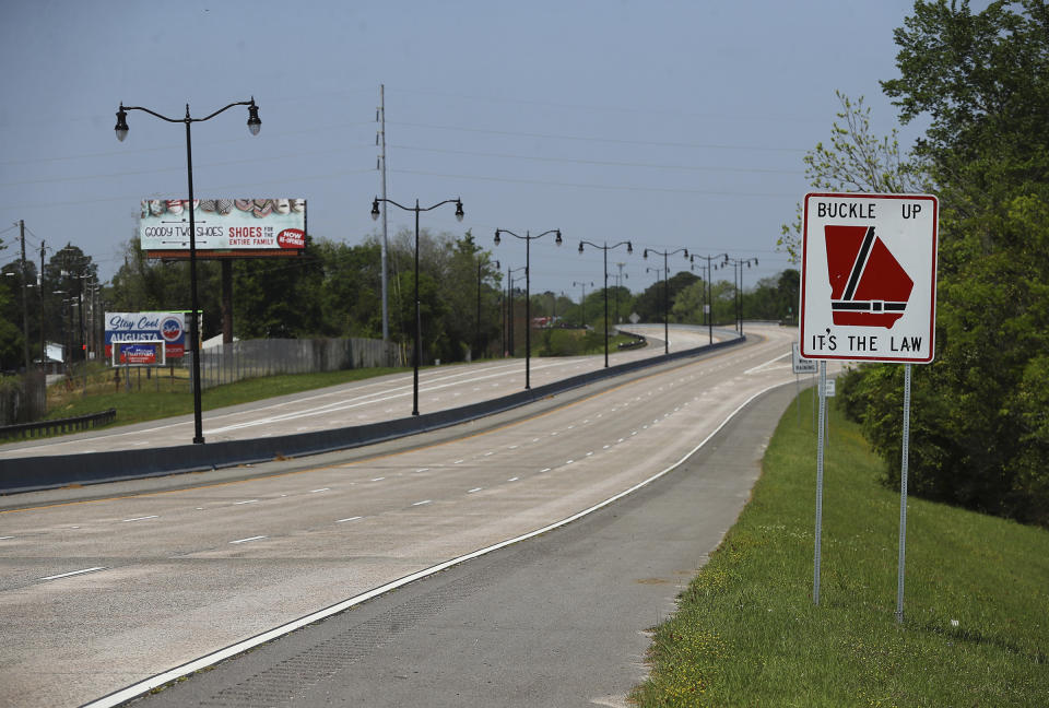 The John C. Calhoun Expressway that turns into Washington Road at the August National Golf Club is quiet on what would've been the first practice round for the Masters on Monday, April 6, 2020, in Augusta, Ga. Augusta National Golf Club is all locked up. Popular restaurants are shuttered, offering only curbside service if they are open at all. Washington Road, which should've been teeming with cars and commerce and humanity, is desolate instead.(Curtis Compton/Atlanta Journal-Constitution via AP)