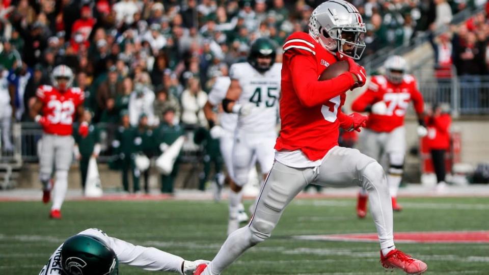 Ohio State Buckeyes wide receiver Gareth Wilson (5) misses a precise shot on the way to the touchdown during the first quarter of an NCAA I Division football game.