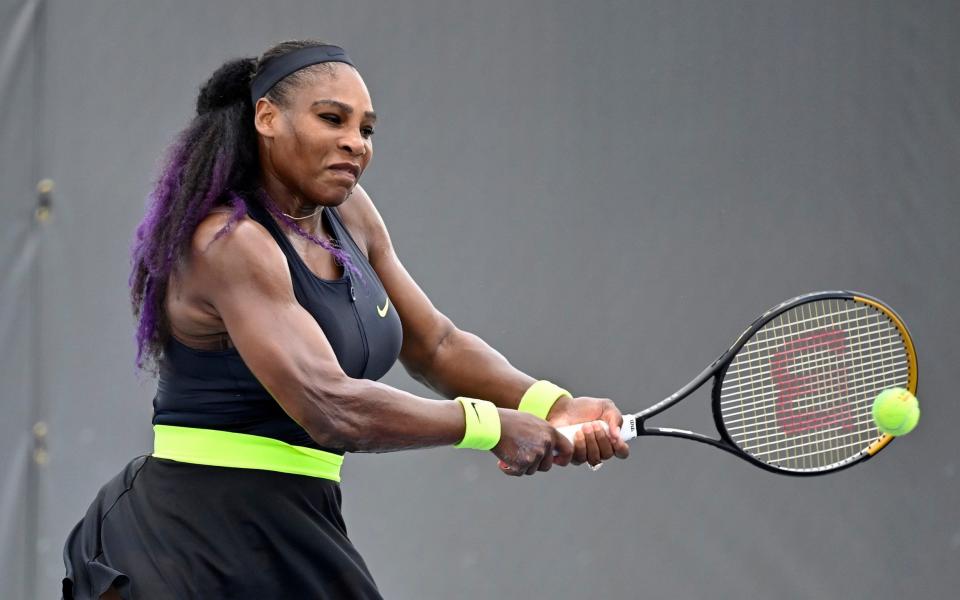 Serena Williams returns a shot to her sister Venus Williams during the WTA tennis tournament in Nicholasville - AP