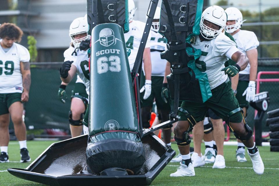 Colorado State football players Drew Moss, left, and Cameron Jackson do a drill on Friday in Fort Collins.